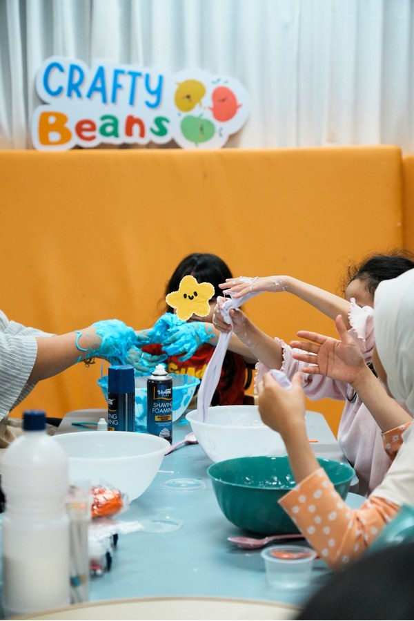 Children making slime at a workshop