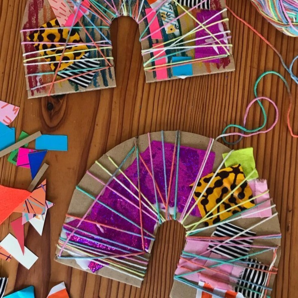 A colorful cardboard and yarn weaving craft from an Event Workshop