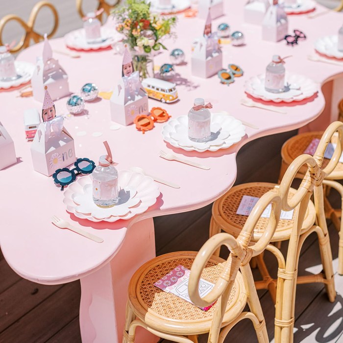 An elegant, coordinated children's table setup at a wedding
